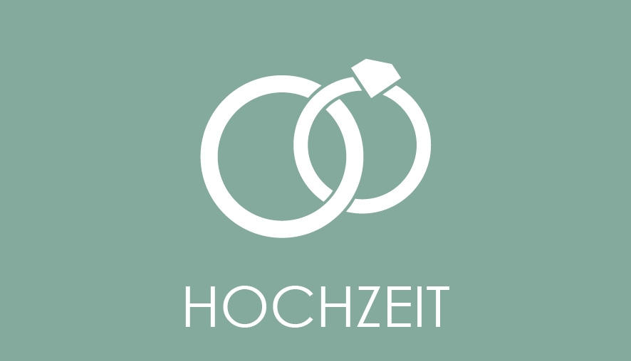 grüner Hintergrund mit weißen Hochzeitsringen Hochzeit